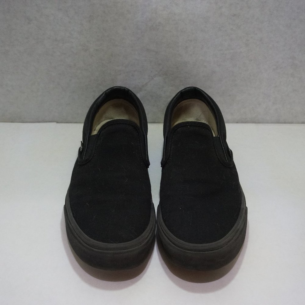 Vans slip-on shoes, U.S. Men's size 7.5, all black.